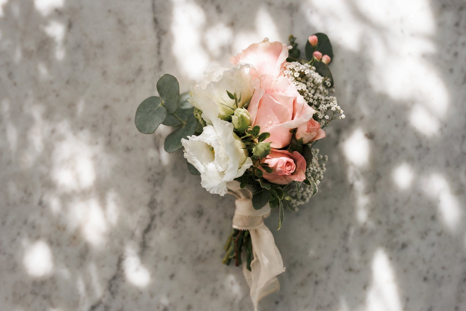A delicate wrist bouquet of fresh flowers