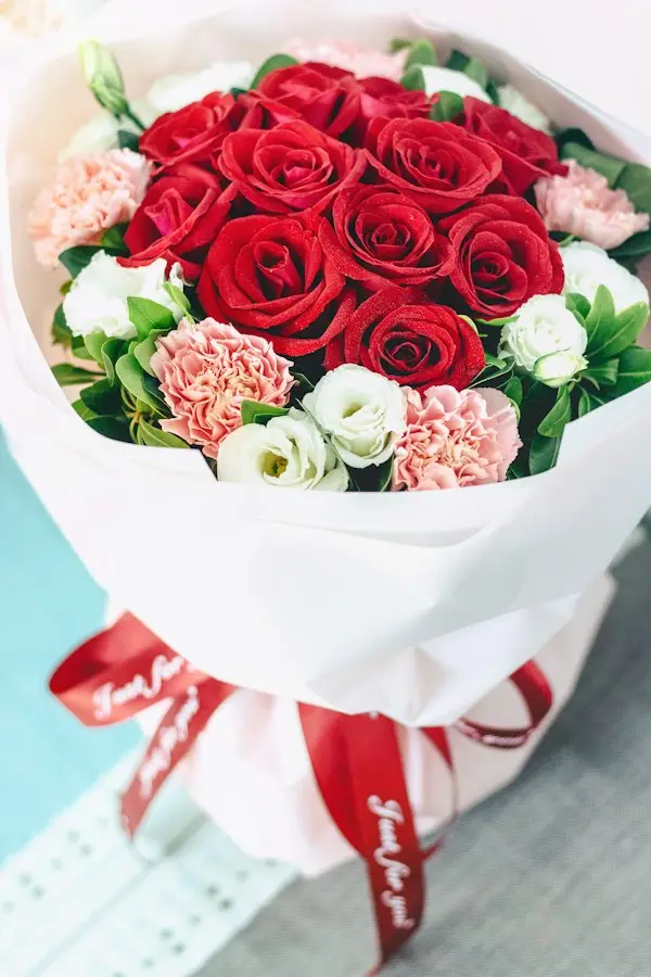 A bouquet of red and white roses