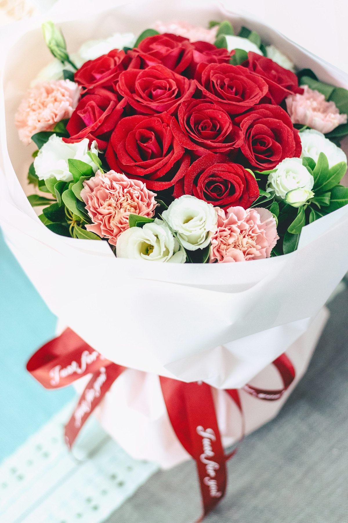 A bouquet of red and white roses