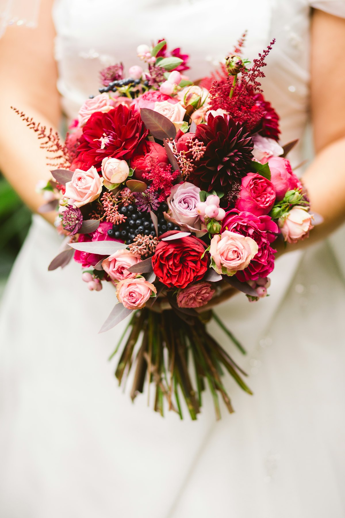 A bride holding her wedding bouquet